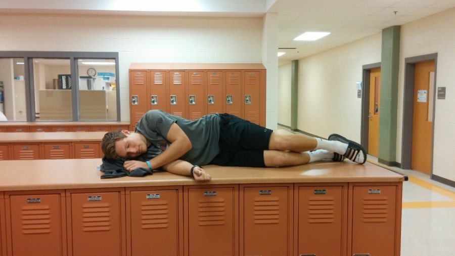 Junior Caleb Cross sleeping on school locker bays.