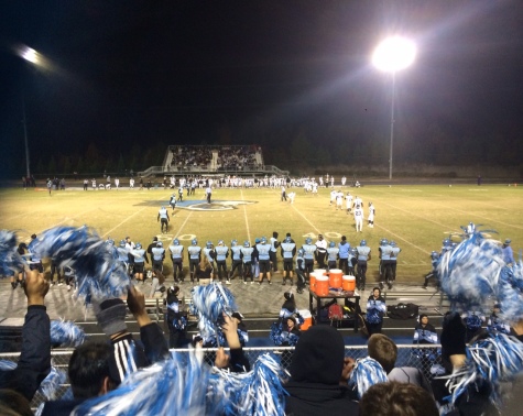 14 November 2014 - The Panther Creek student section waved their Pom-Poms with passion as their Catamounts defeated Holly Springs 24-21 in 2OT. 
