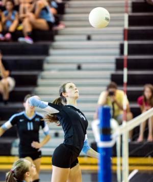 Caitlyn Della goes up for a spike in a Panther Creek home match. Della went second team all-conference. 