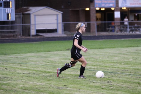 Emma Socha (6) dribbles up the field against Athens Drive. Panther Creek won the match 4-0. 