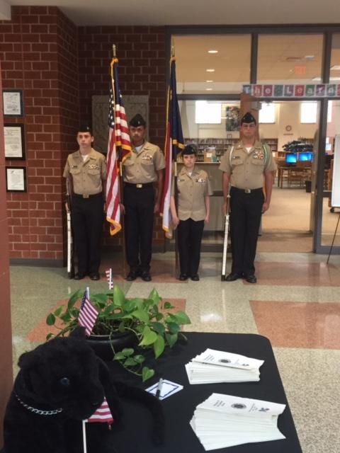 Carys JROTC stands at attention after posting colors (flags).